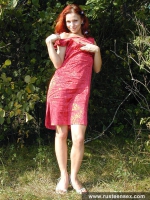 Teen redhead posing naked outdoor