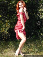 Teen redhead posing naked outdoor