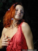 Teen redhead posing naked outdoor