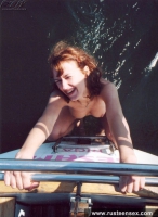 Naked teen redhead posing on yacht