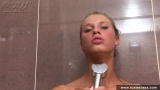 Russian teen blonde masturbates taking a shower