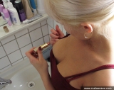 Russian teen blonde posing in the toilet room