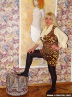 Mature blonde with big tits showing pussy