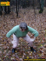 Outdoor pissing on dry leaves