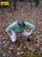Outdoor pissing on dry leaves