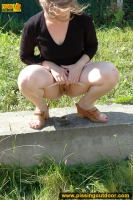 Teen brunette pisses outdoor