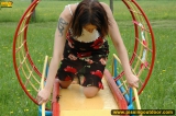 Outdoor pissing on a park slide