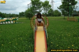Outdoor pissing on a park slide
