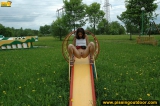 Outdoor pissing on a park slide