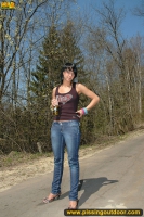 Outdoor pissing on asphalt path