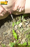 Teen girl enjoys pissing outdoor in the forest