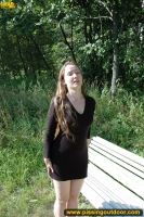 Teen blonde pissing outdoor on the bench in a park