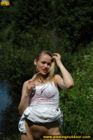 Outdoor pissing in the summer park pool