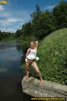 Outdoor pissing in the summer park pool
