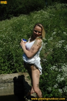 Outdoor pissing in the summer park pool