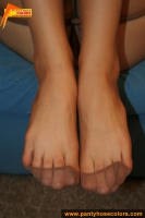 Pantyhosed teen brunette shows her nyloned feet