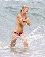 Pamela Anderson Goes Topless on a Beach in France