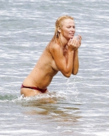 Pamela Anderson Goes Topless on a Beach in France