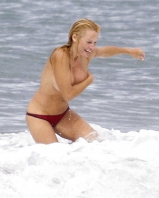 Pamela Anderson Goes Topless on a Beach in France