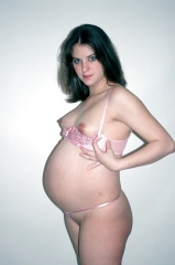 Young and pregnant naked