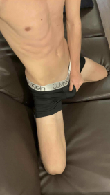 Young teen boy showing off