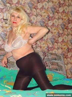 Mature blonde with big tits showing pussy - N