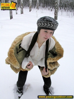 Pissing outdoor in the snow in winter day - N