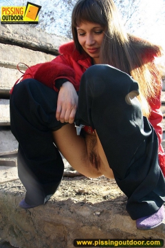 Teen brunette outdoor pissing in a suburb street - N