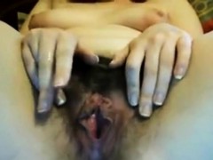 Two fingers is what her hairy juicy pussy wants