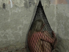 BDSM slave toyed by maledom while restrained