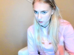 Blonde teen in solo action with her pussy