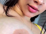 Brunette seductress working her big boobs and hot ass